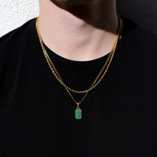 Gold-tone double-chain necklace with green rectangular stone pendant