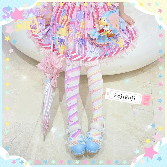 Knee-high socks with striped pattern in pastel pink, yellow, and light purple