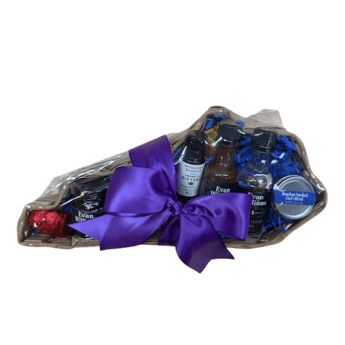 Kentucky sampler gift tray with blue bourbon items tied with a purple satin bow