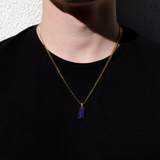 Gold chain necklace with small rectangular lapis lazuli stone pendant