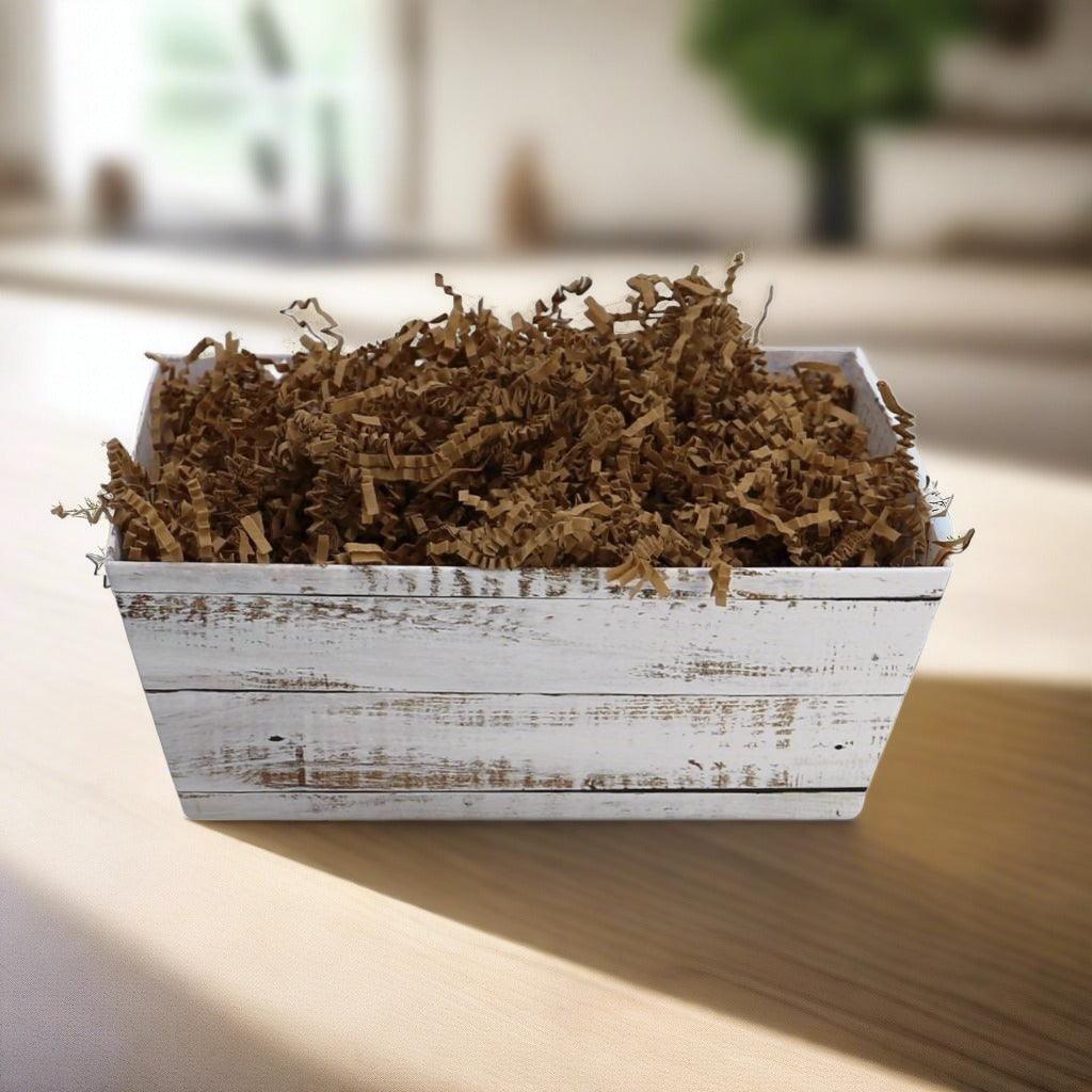Breakfast gift basket filled with brown shredded paper filler