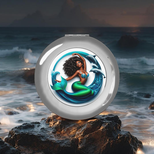 Silver glossy compact travel mirror with mermaid graphic, closed round design