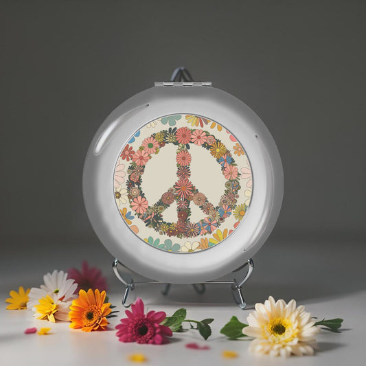 Compact travel mirror, silver glossy with peace sign floral graphic on the mirror face