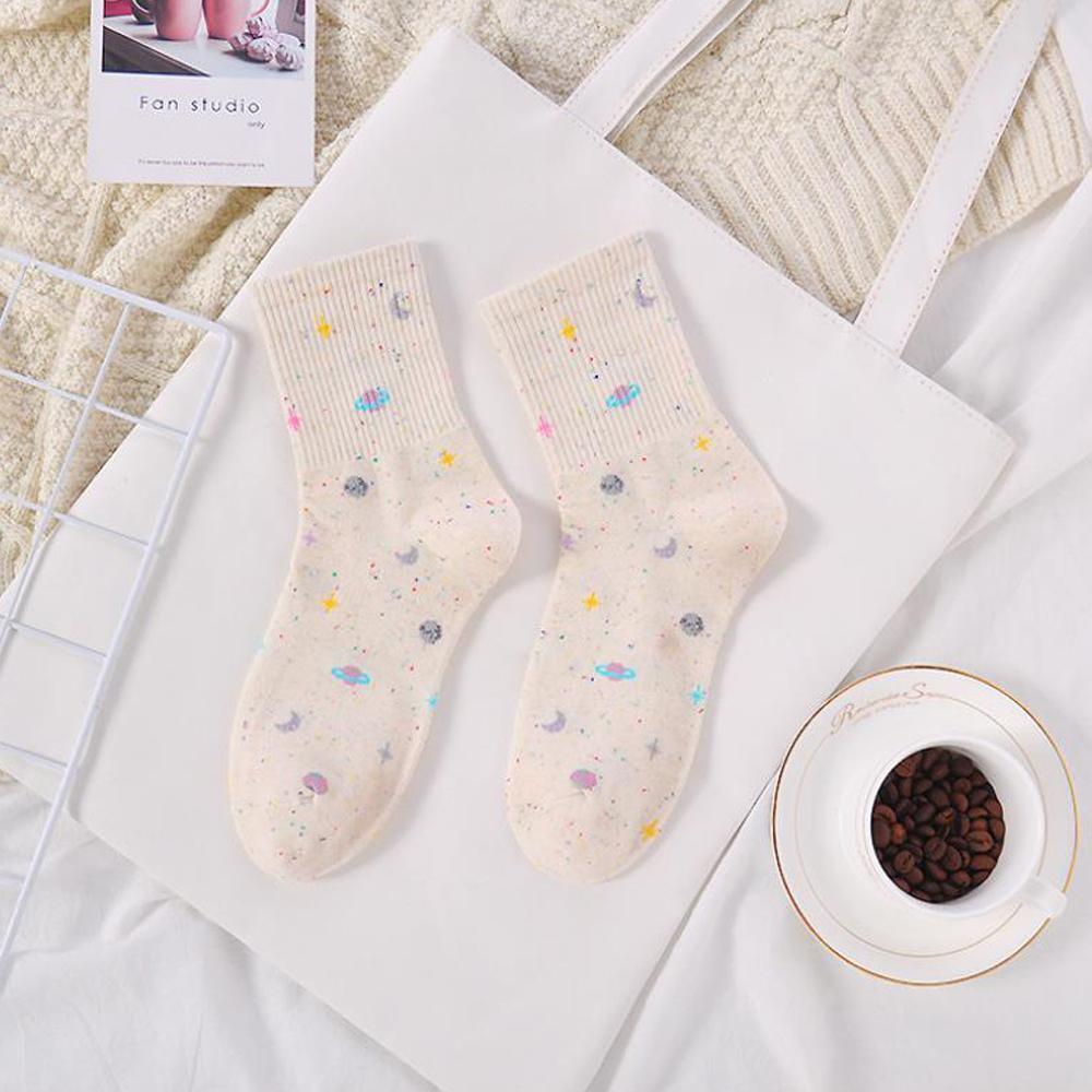 Cream ribbed crew socks with pastel galaxy prints of moons, planets, and stars