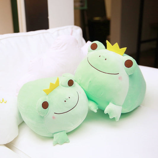 Pair of green frog plushies with yellow crowns, smiling stitched faces, soft fabric