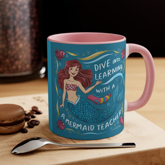 Pink accent mug with teal mermaid illustration, "Dive into Learning" message