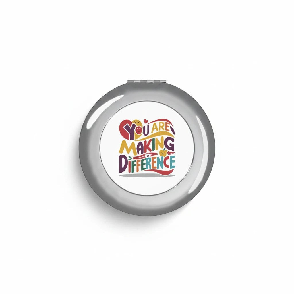 Silver glossy compact travel mirror with centered logo graphic on smooth front