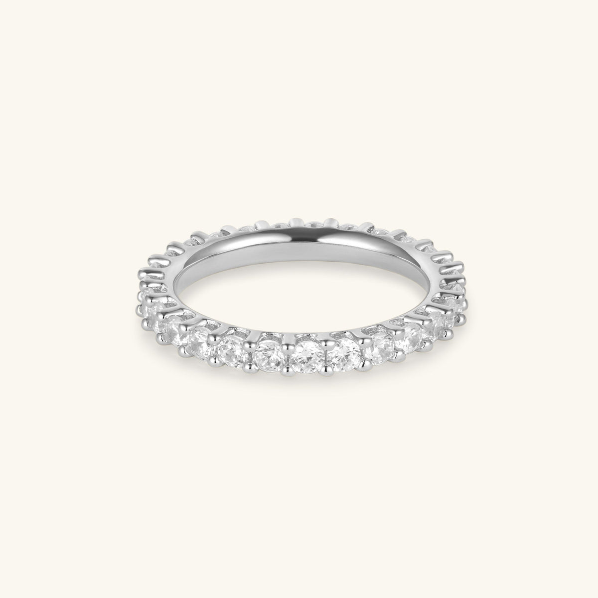 Silver eternity ring with clear round stones on a 2.5 mm band, half-halo style