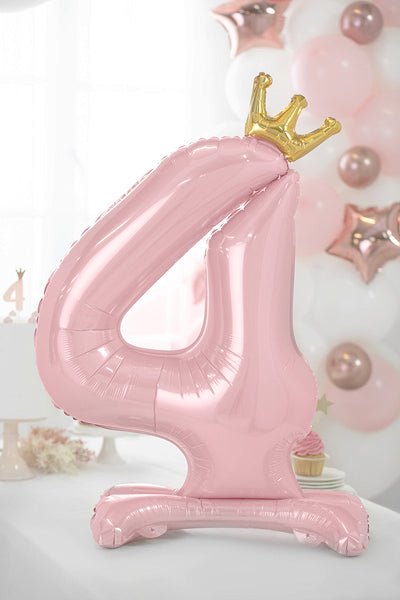 Pink number 4 standing foil balloon with gold crown topper