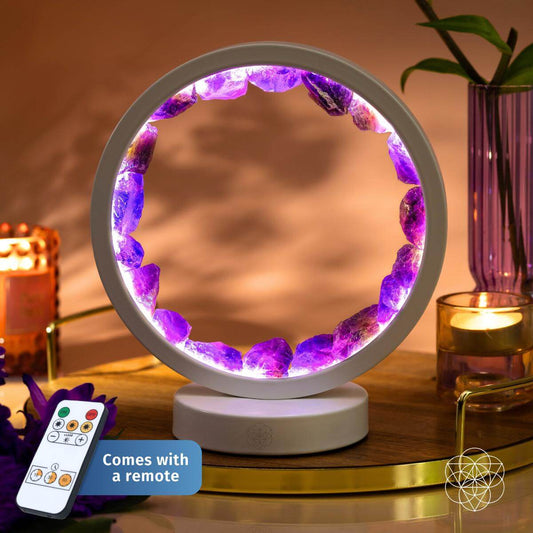 Amethyst healing lamp with glowing purple crystal ring and white stand