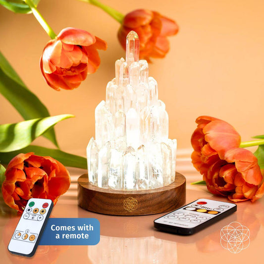 Lit clear crystal tower lamp on wooden base with remote control