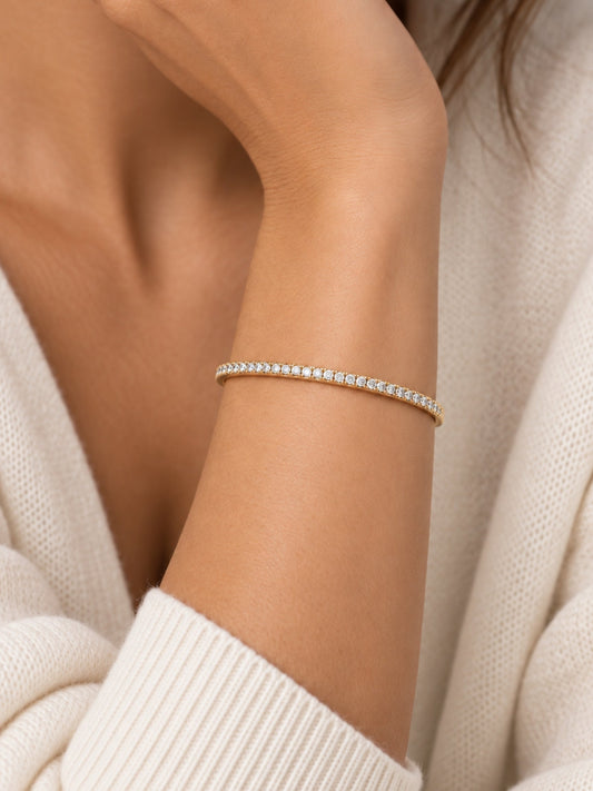 Thin gold-filled pave cuff bracelet on a wrist