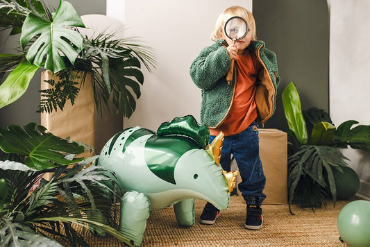 Standing triceratops foil balloon, light green and dark green, with gold horns