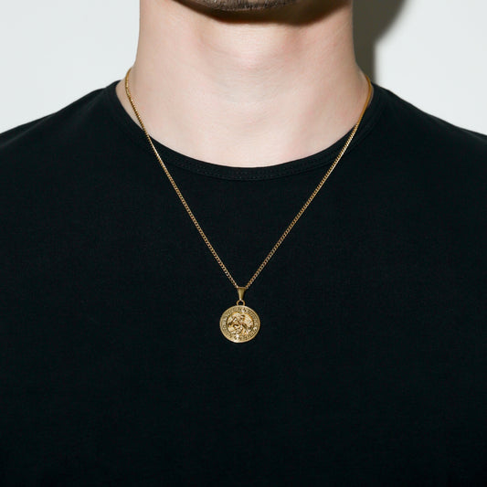 Gold lightning pendant necklace with round medallion charm hanging on chain