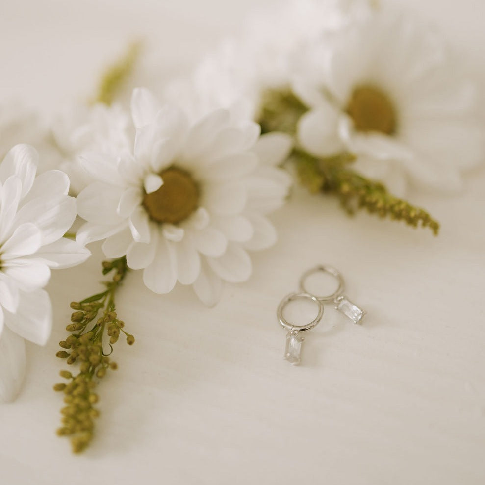 Silver dangle hoops with clear rectangular stones