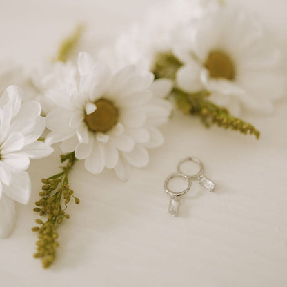 Silver dangle hoops with clear rectangular stones