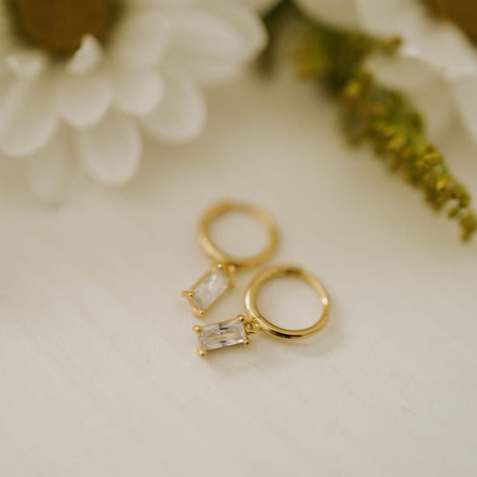 Sophie Baguette Diamond Dangle Hoops in gold with clear rectangular stones