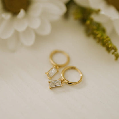Sophie Baguette Diamond Dangle Hoops in gold with clear rectangular stones