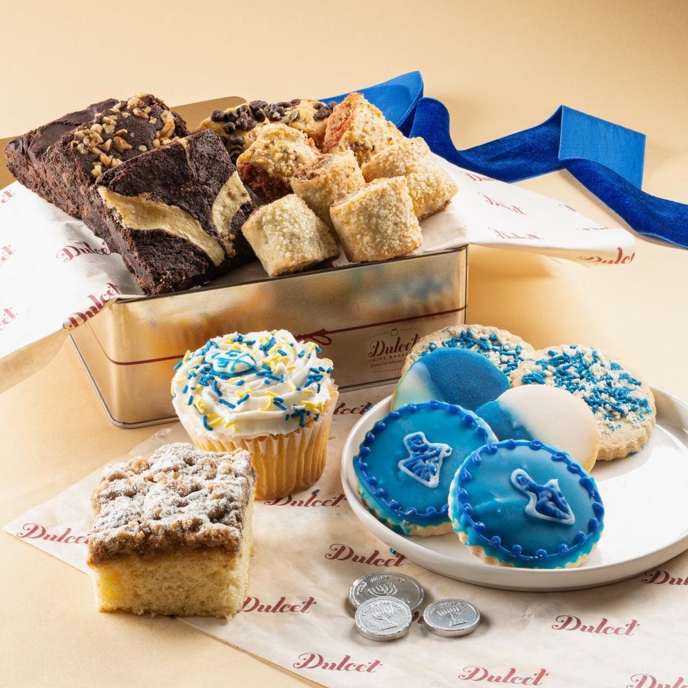 Deluxe Hanukkah confections gift tin with blue-frosted cookies, cupcakes, and brownies