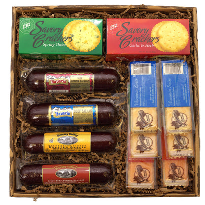 Charcuterie gift box with crackers, salami, and cheese packs in a wooden tray