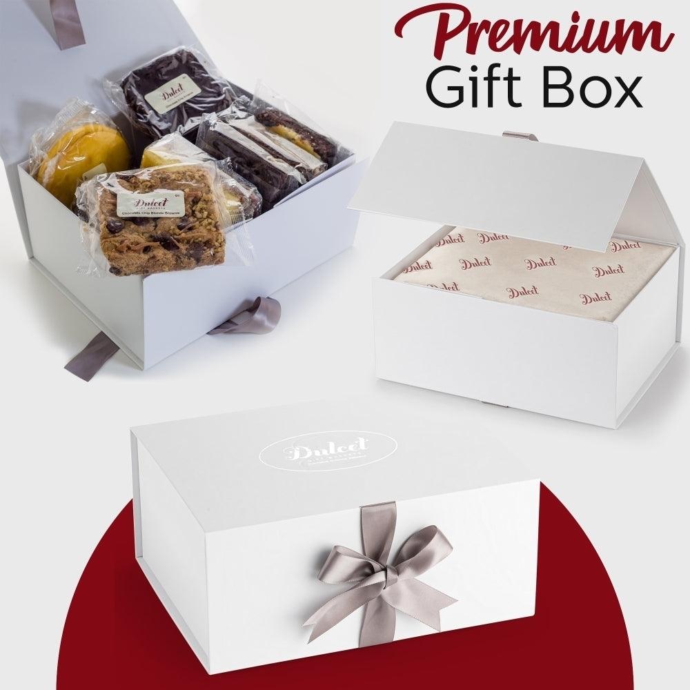 Premium gift box with ribbon, open to wrapped pastries and cookies
