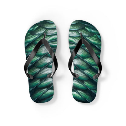 Pair of green merman scales flip flops with black thong straps, side view