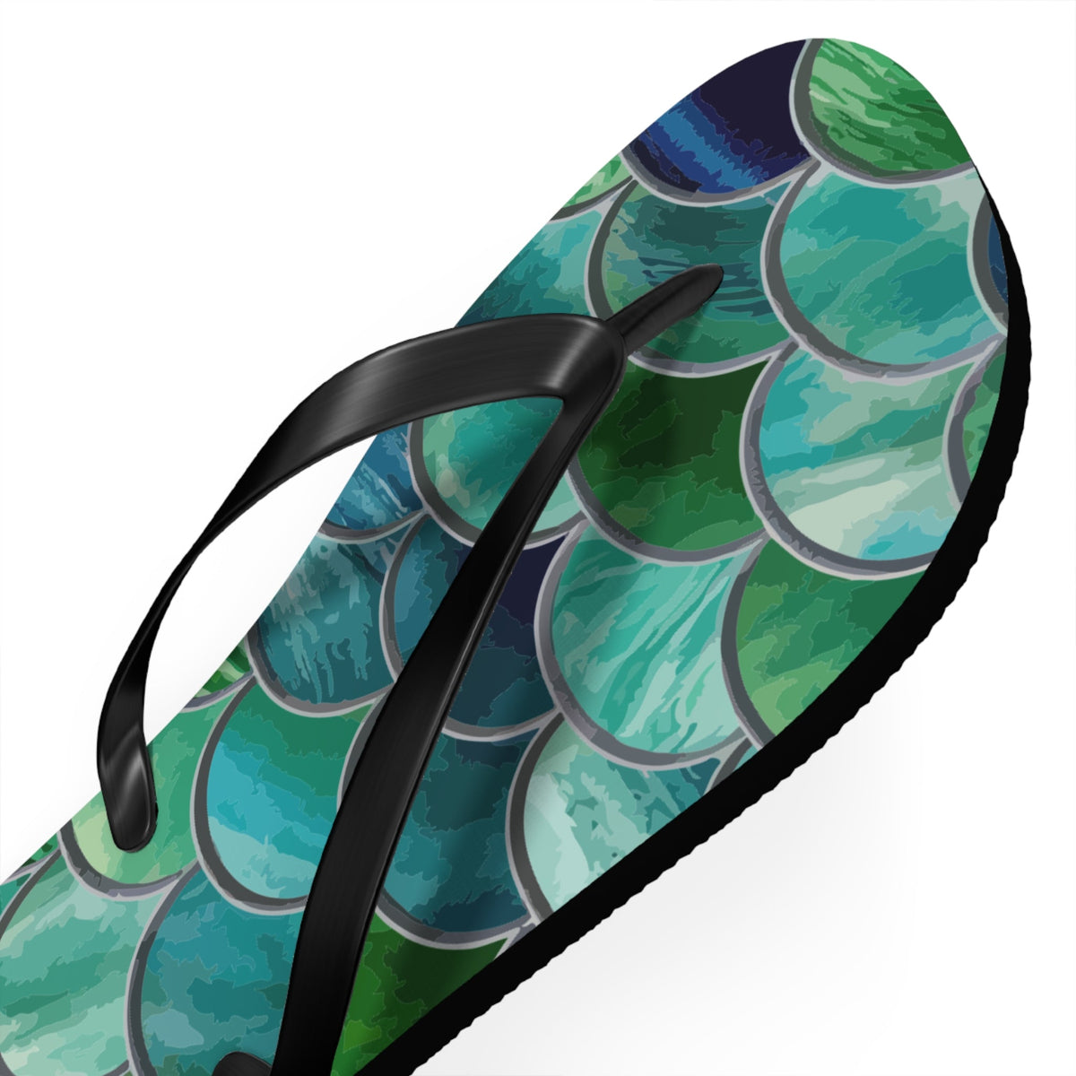 Mermaid-scale flip-flop detail with black thong strap and green-blue scale design