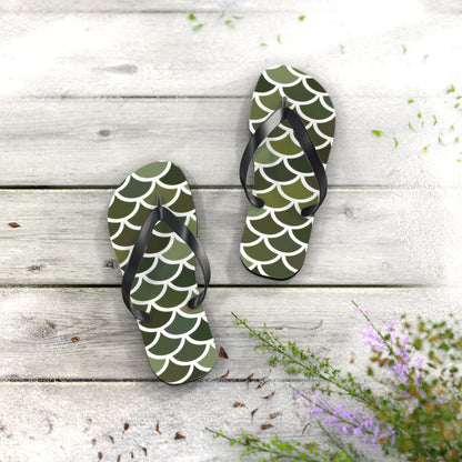 Green flip-flops with white scale pattern and black thong straps, standing upright