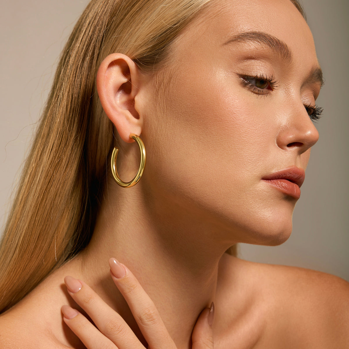 Gold-filled 30mm hoop earrings on blonde model, smooth round gold hoops