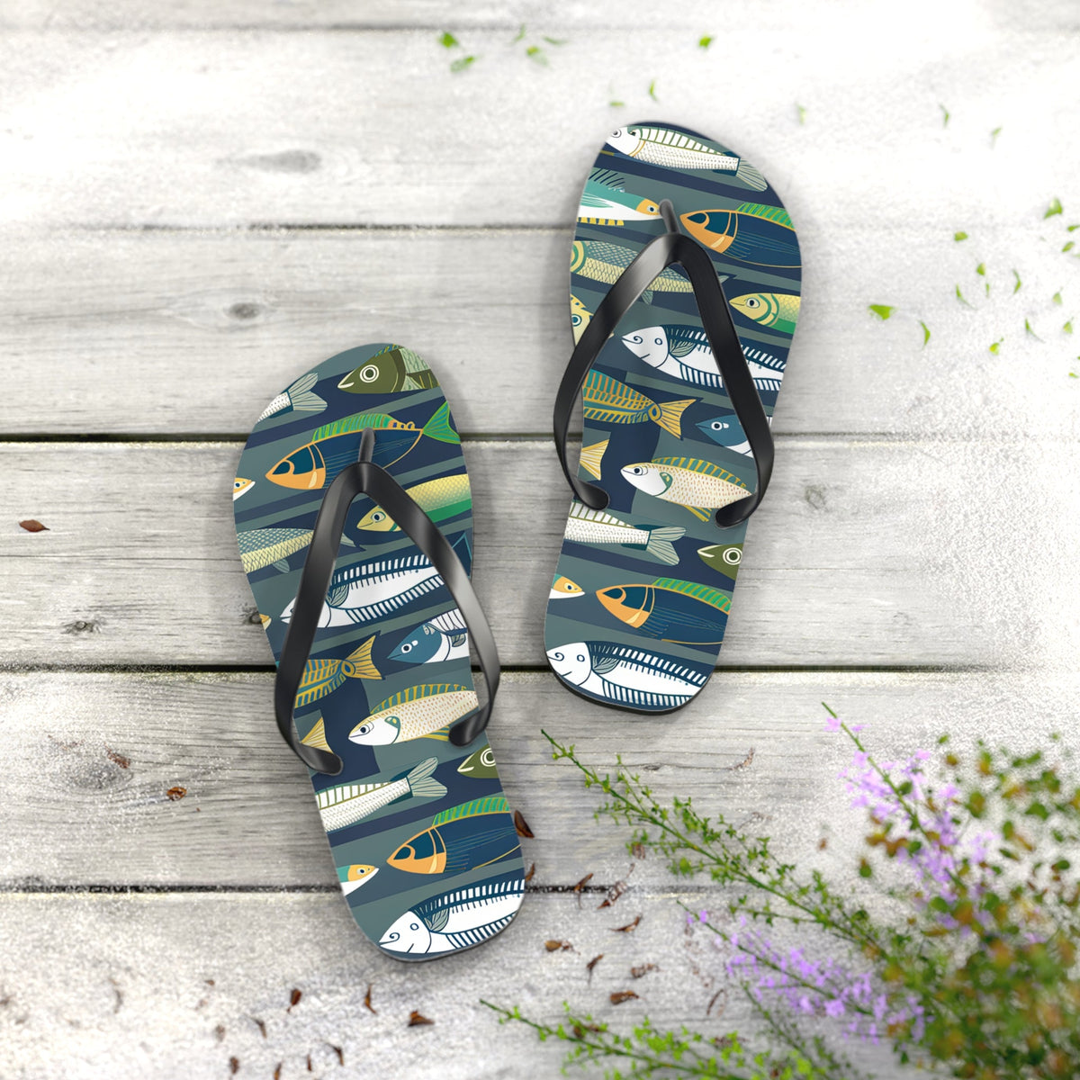 Pair of fish-print flip flops with black straps and dark blue patterned footbeds