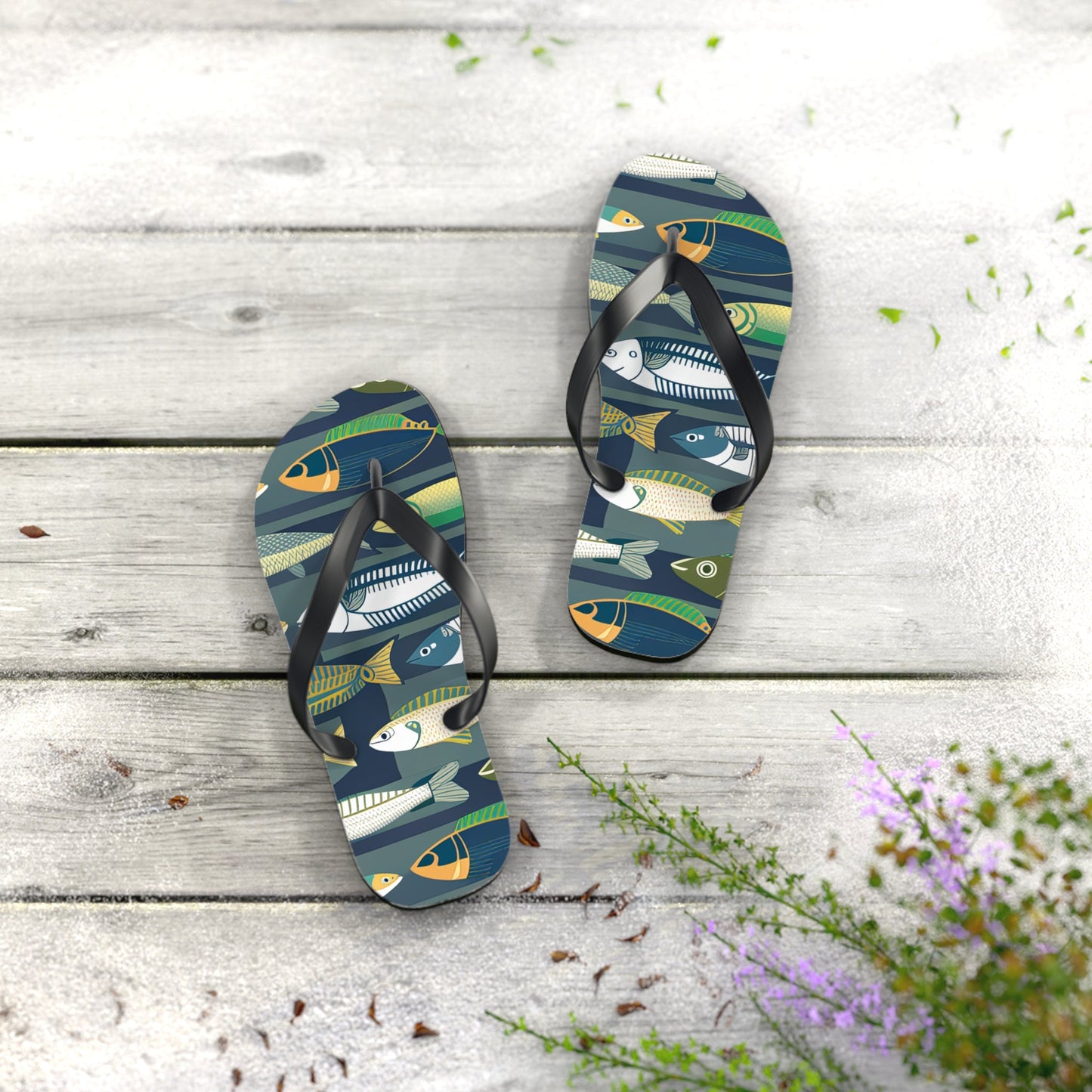 Fish-print flip-flops with black thong straps, angled view