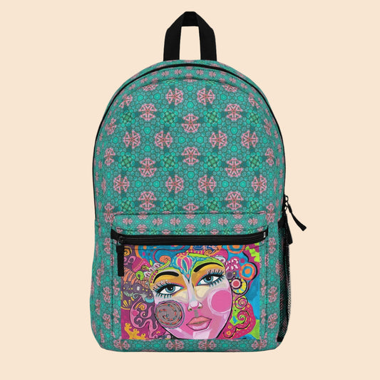 Green art backpack with colorful face illustration front pocket and black top straps