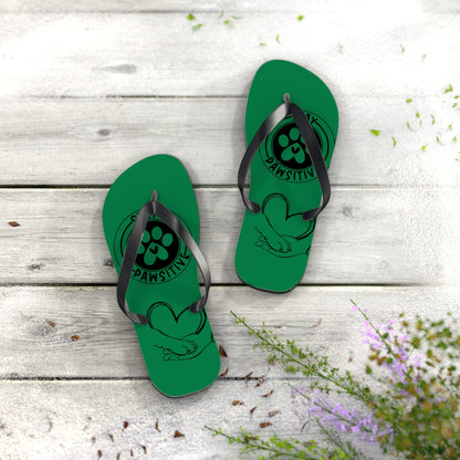 Green flip-flops with black toe straps and paw-print graphic on footbed