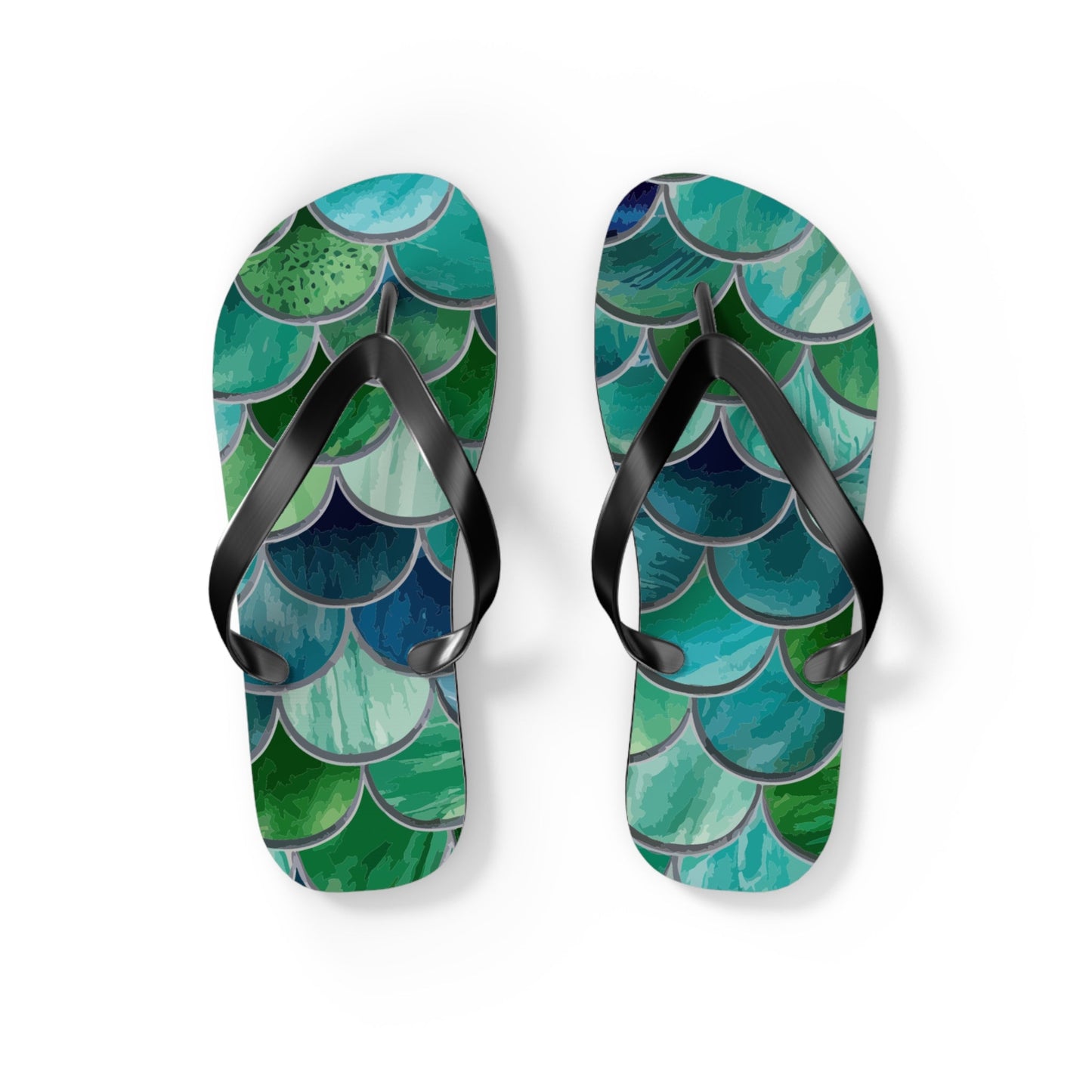 Mermaid-scale flip flops, black straps over teal, blue, and green scale print