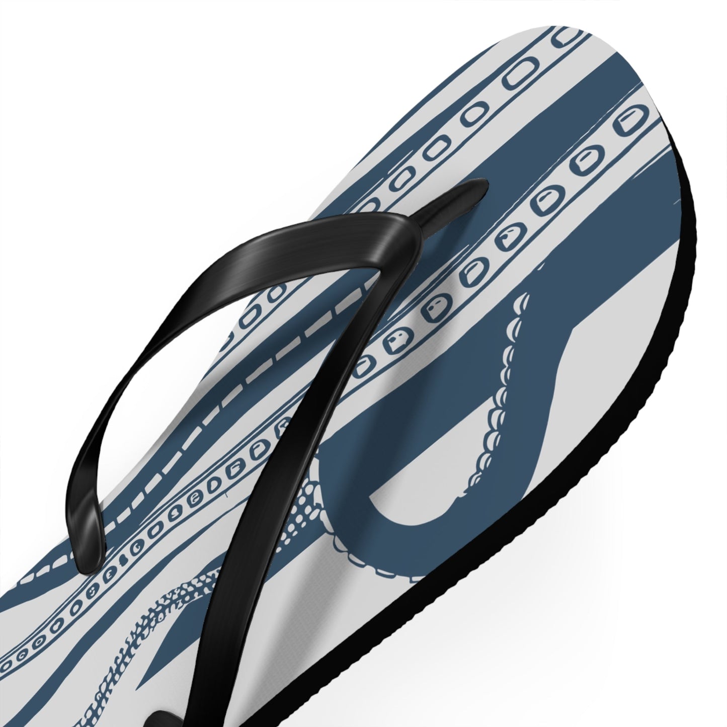 Close-up of blue-and-white octopus patterned flip-flop with black strap