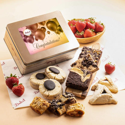 Metal cookie and brownie tin with 'Congratulations!' card and assorted treats