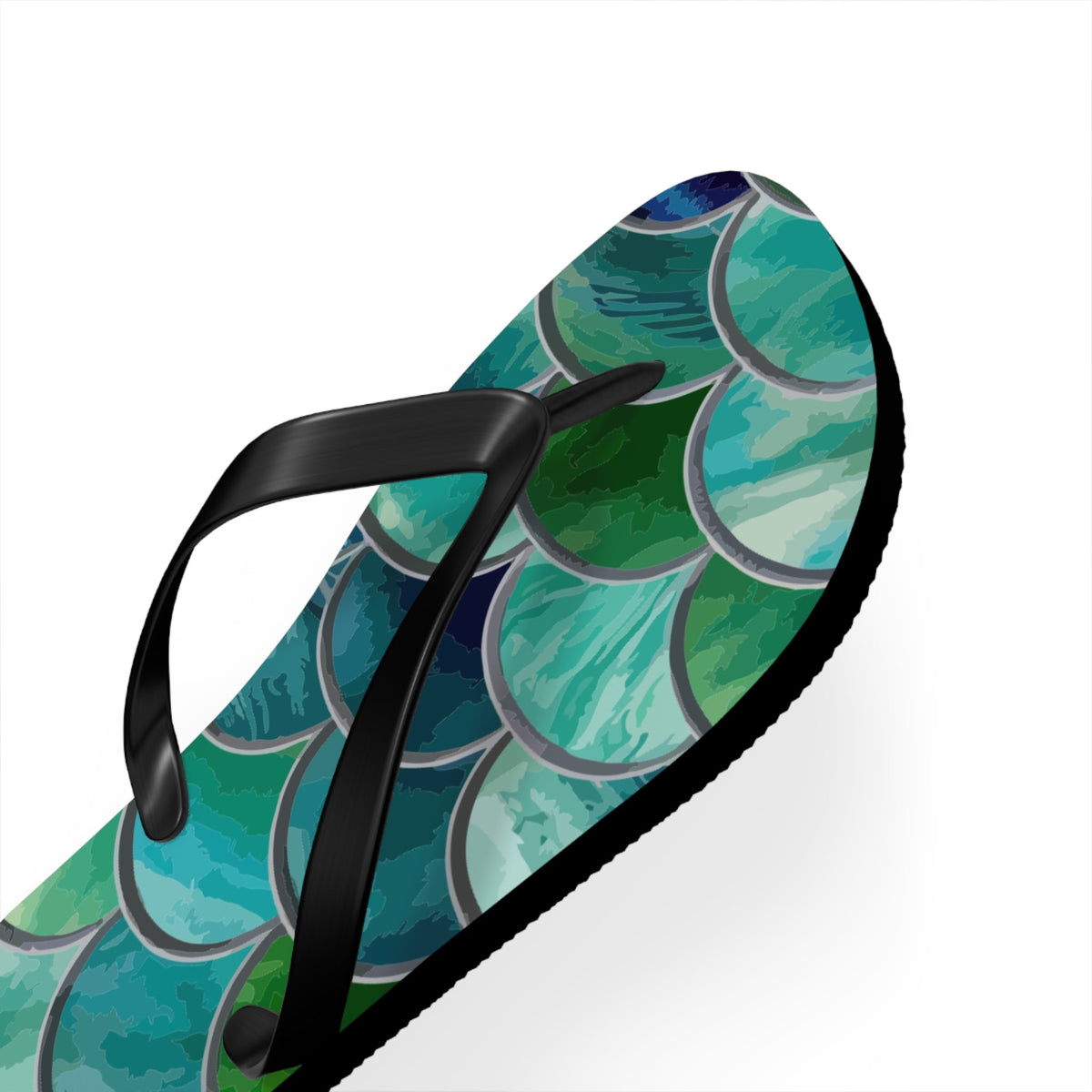 Close side view of mermaid-scale flip flop with black strap and sea-scale pattern