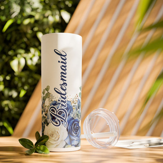 White 20oz skinny tumbler with blue floral roses, script custom name, and clear lid top.
