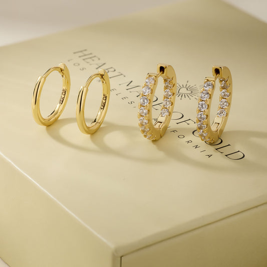 Gold hoop earring set with two plain hoops and two pavé crystal hoops