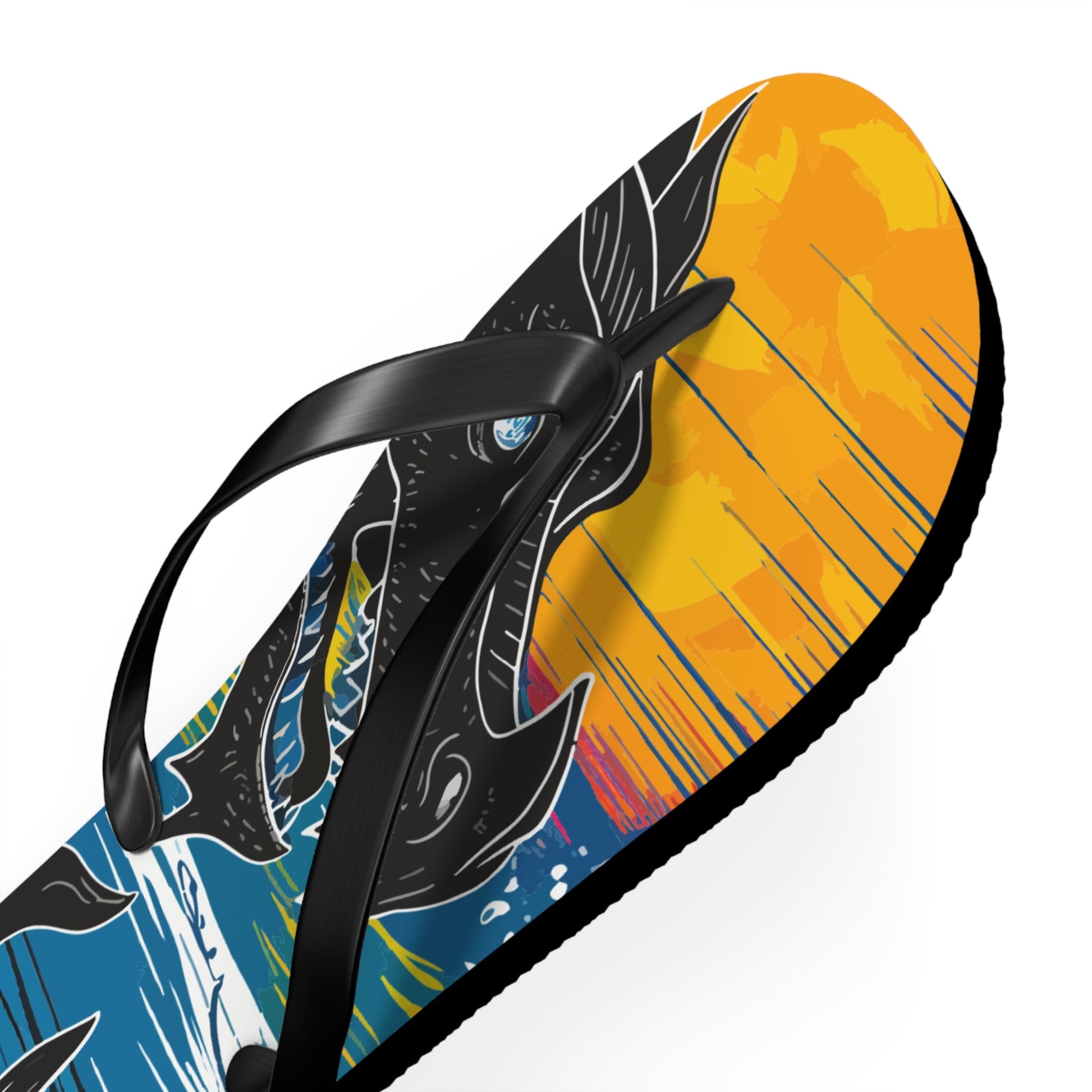 Close-up dragon flip-flop with black thong strap and orange-yellow heel graphic