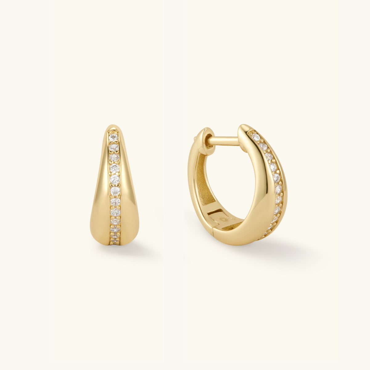Gold teardrop huggie earrings with pavé diamond accents