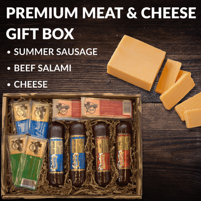 Meat and cheese gift basket with sliced cheese on a board and assorted items in the box