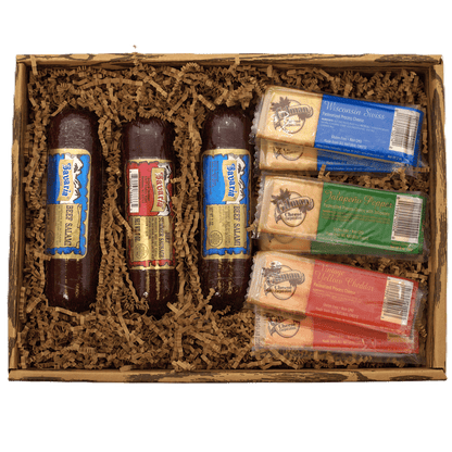 Open meat and cheese gift box with salami and cheese bars in wooden filler