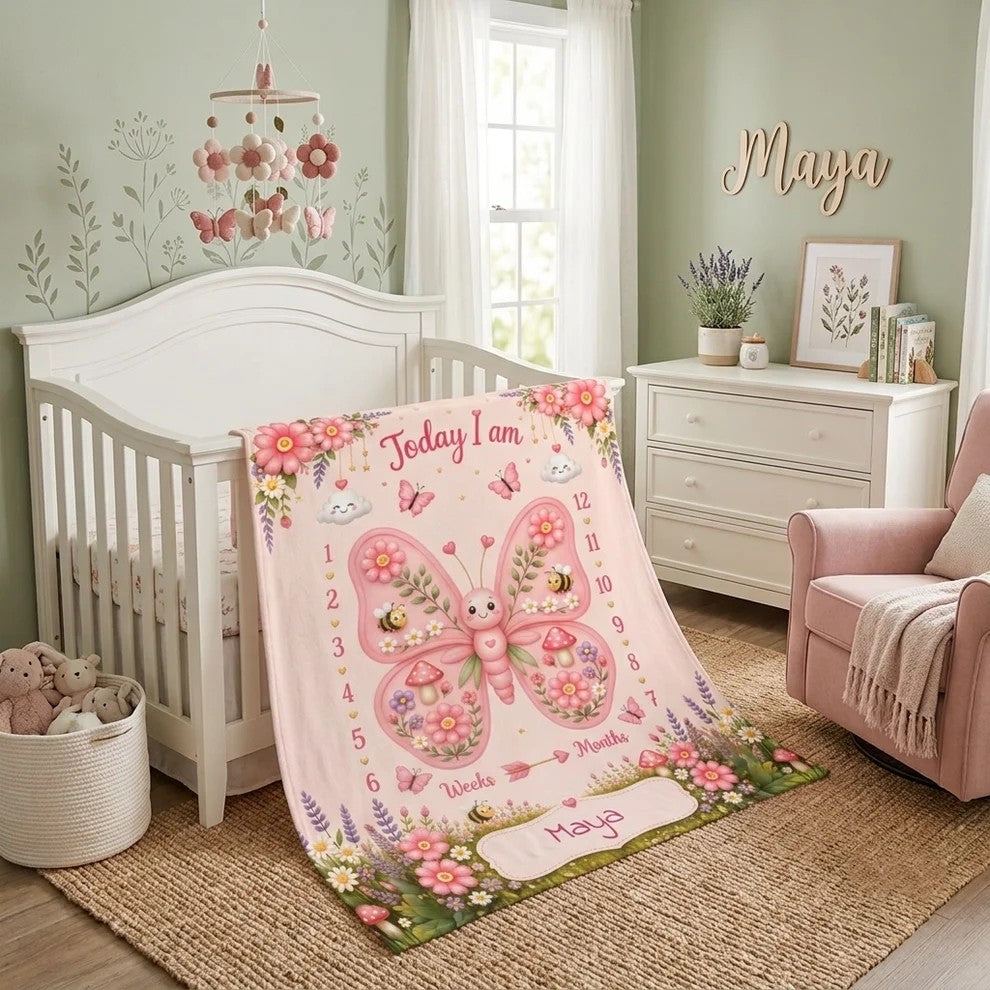 Personalized baby milestone blanket in pink with bunny, butterfly art, and name Maya