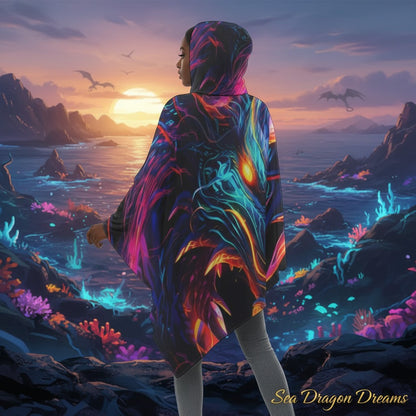 Neon dragon printed hooded cape with draped sides and layered, asymmetrical bottom
