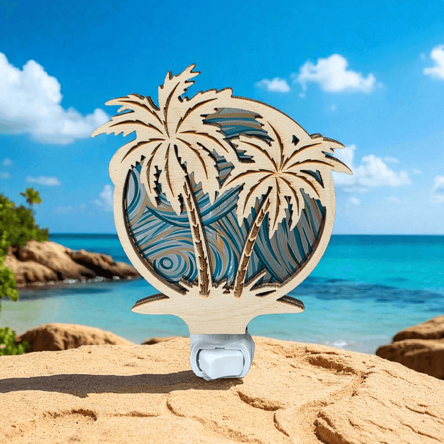 Palm tree LED night light on sandy beach with blue wave palm artwork