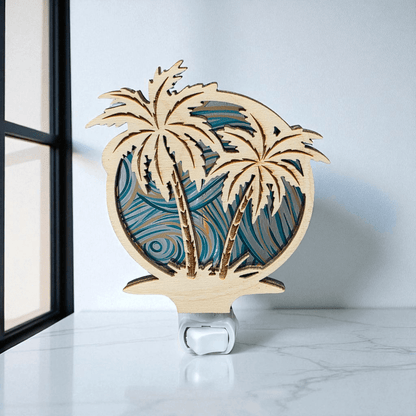 Palm tree LED night light close-up with blue wave palms and white base