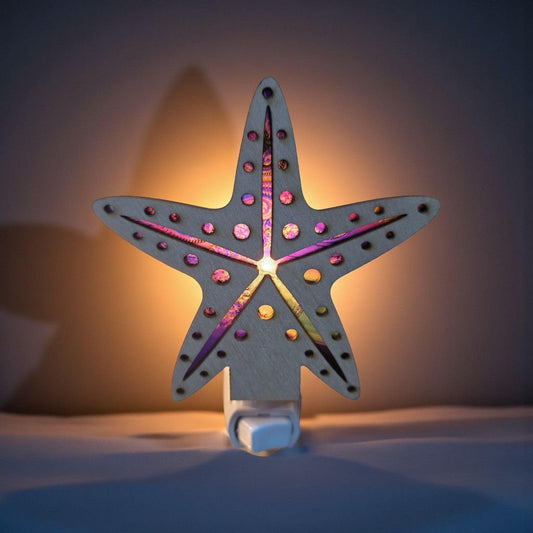Starfish-shaped LED nightlight in blue with multicolor dots and warm purple glow