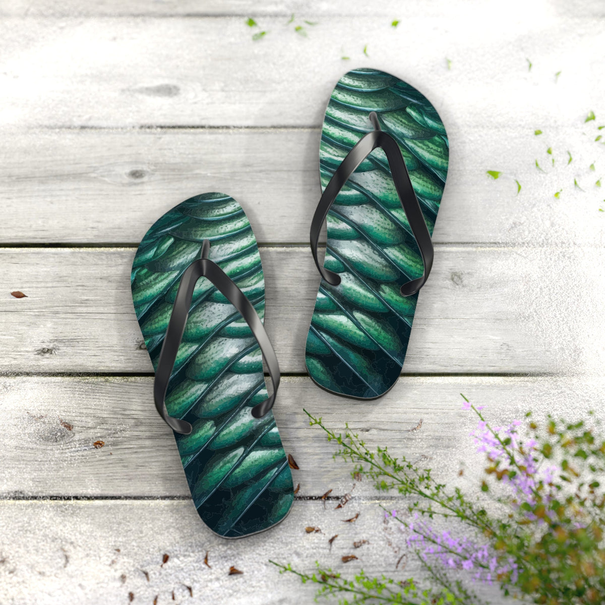 Green scale-pattern flip-flop sandals with black straps, shown side by side