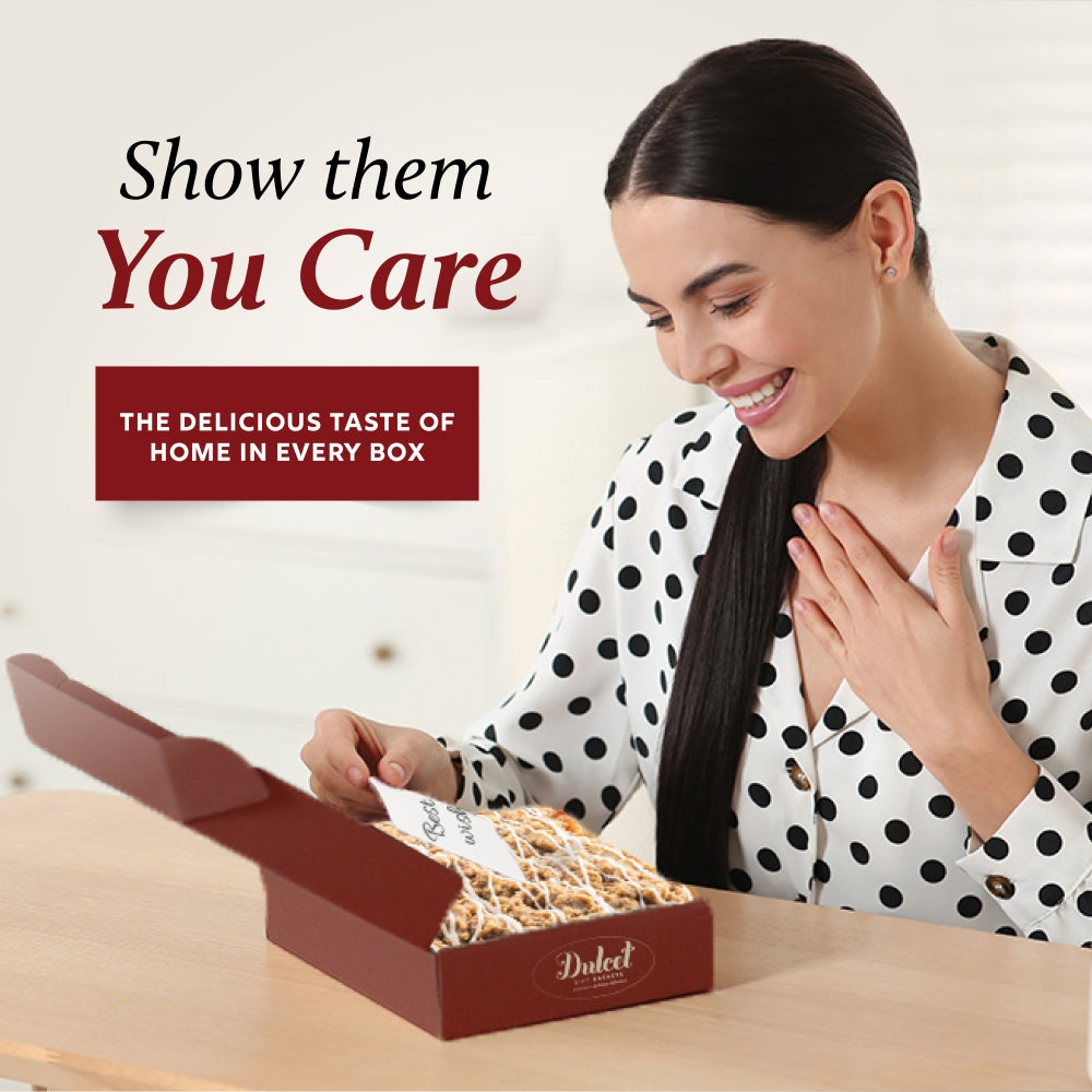 Raspberry Bakery gift box with Dulcet logo open, showing assorted pastries inside